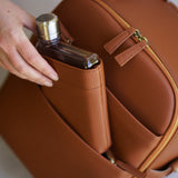 Memobottle waterbottle inserted into matching Mina Camera bag in Tan vegan leather