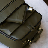Memobottle water bottle in pocket with matching Lyra Camera backpack in olive vegan leather