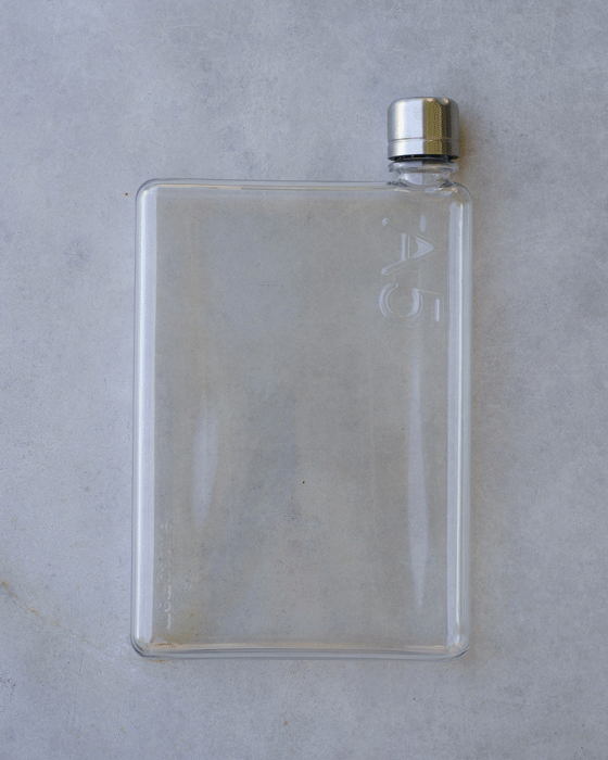 Water bottle for camera bag shown in three different vegan leather colours