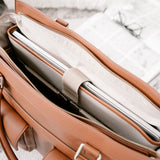 Interior of camera bag with secure padded compartment with Macbook laptop