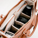 Interiour of bag with padded Dividers and DSLR Camera, lens and laptop
