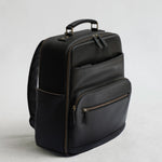 Lyra Camera Backpack - front view in black vegan leather