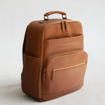 Lyra Camera Backpack - front view in tan vegan leather