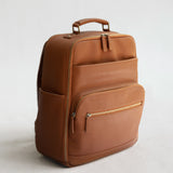 Lyra Camera Backpack - front view in tan vegan leather
