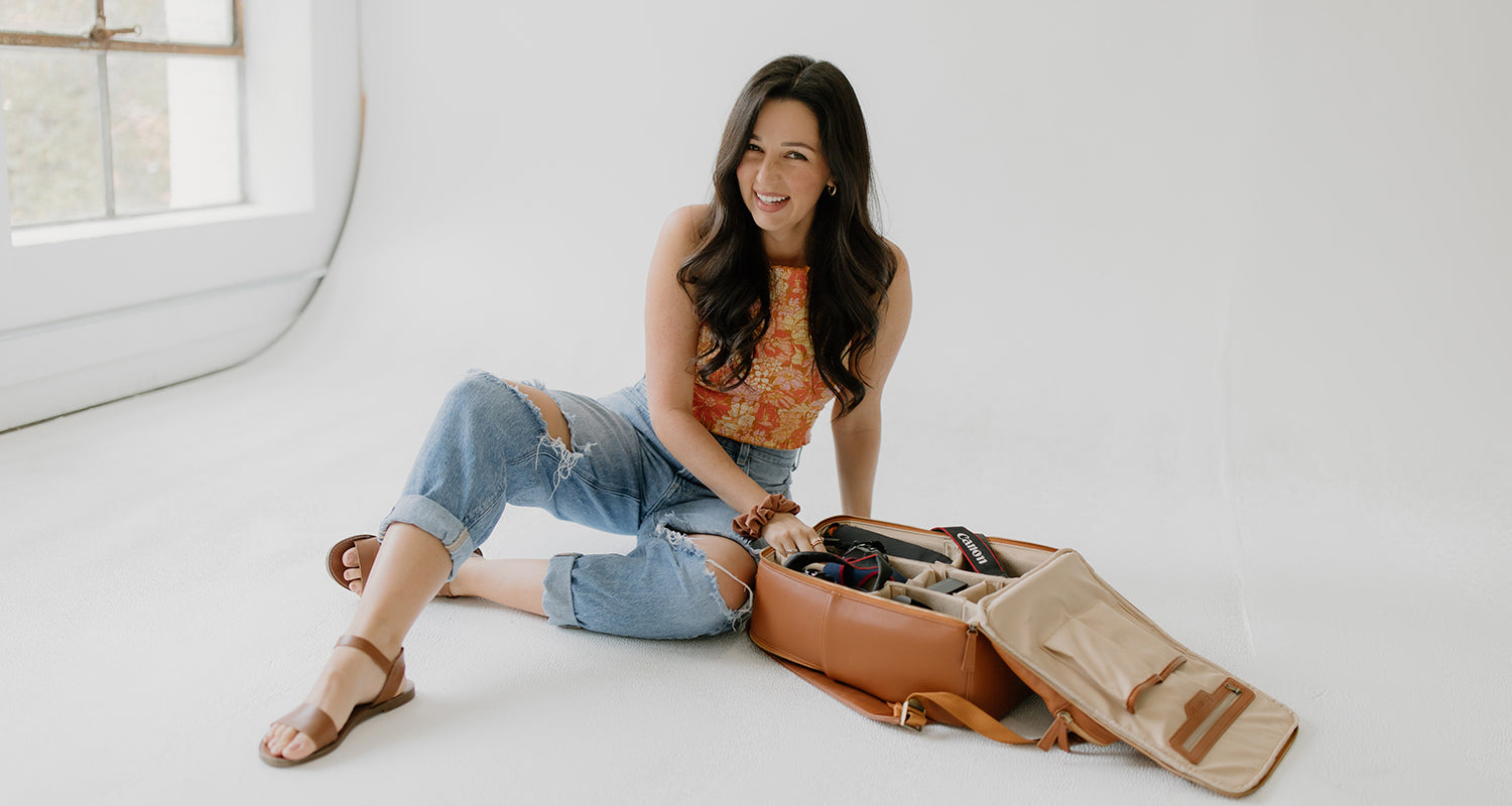 Woman photography in photo shoot with camera bag