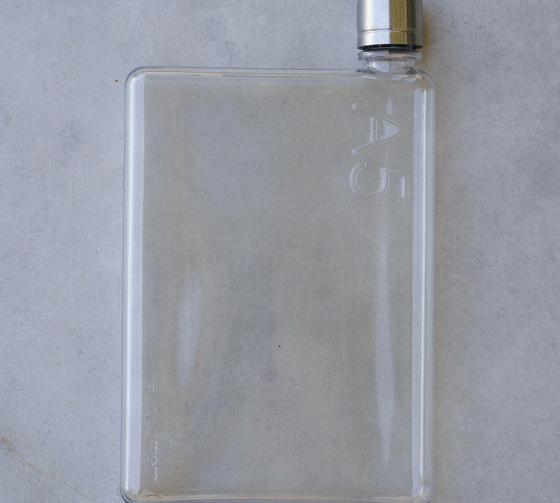 Water bottle for camera bag shown in three different vegan leather colours