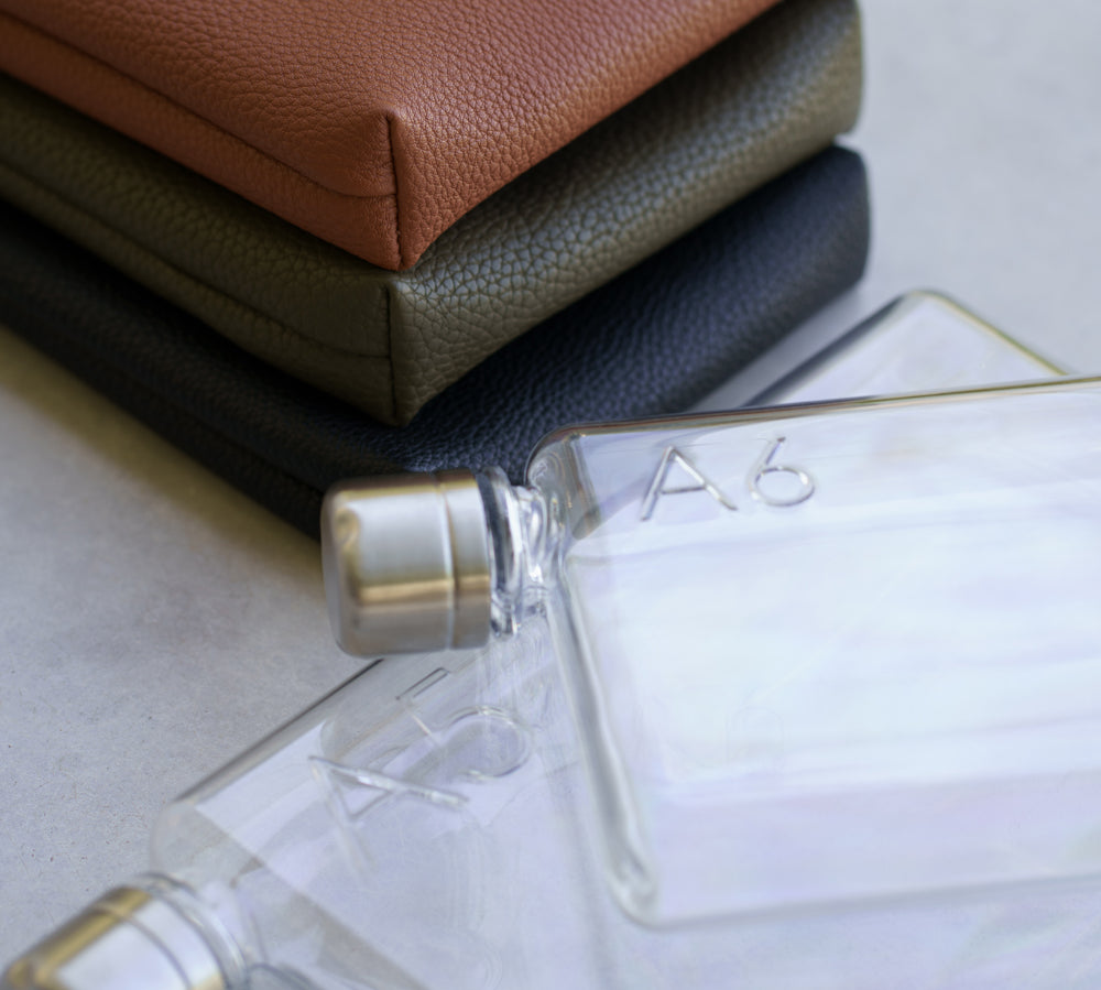 Camera Bag water bottle in two sizes with matching vegan leather sleeves in tan, olive and black