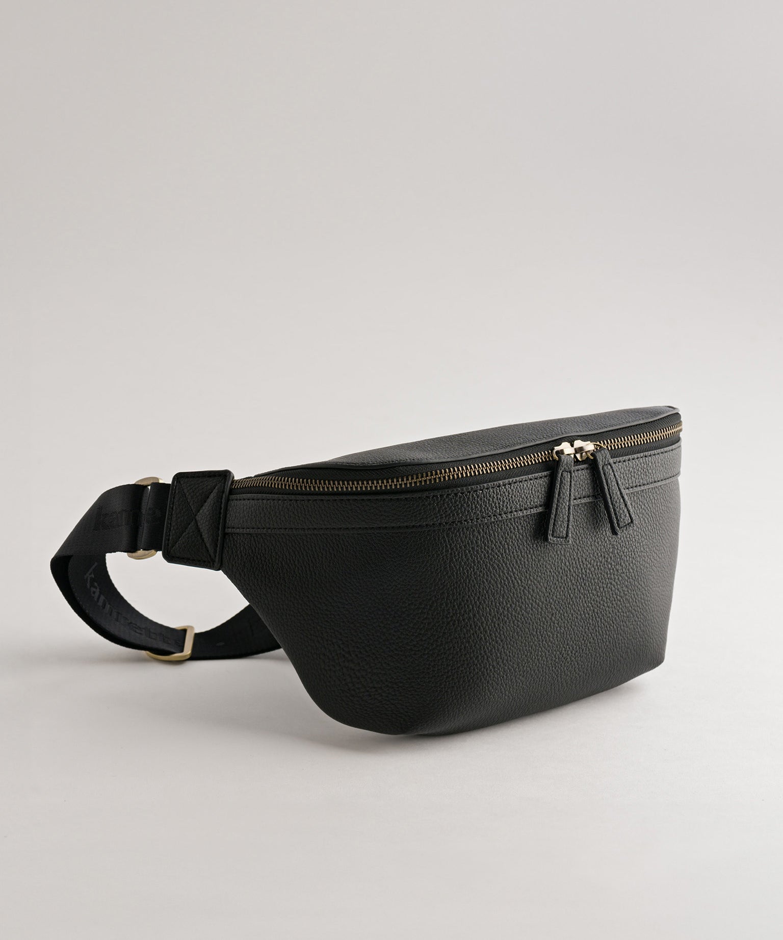 Versa Camera Crossbody - front view  of fanny pack in black vegan leather
