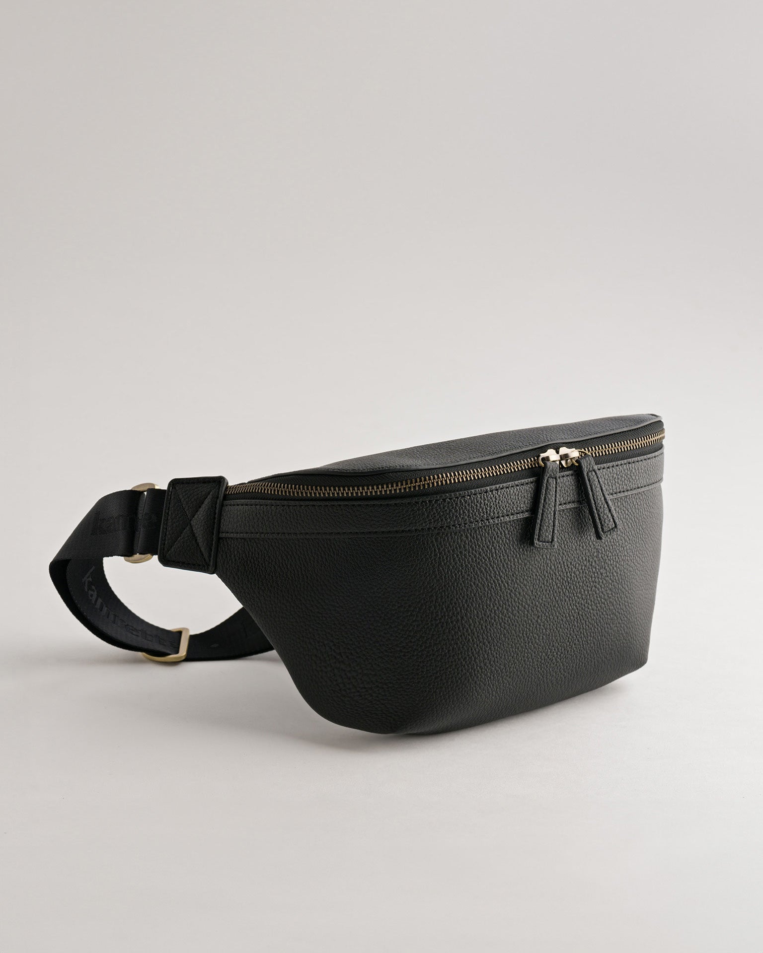 Versa Camera Crossbody - front view  of fanny pack in black vegan leather