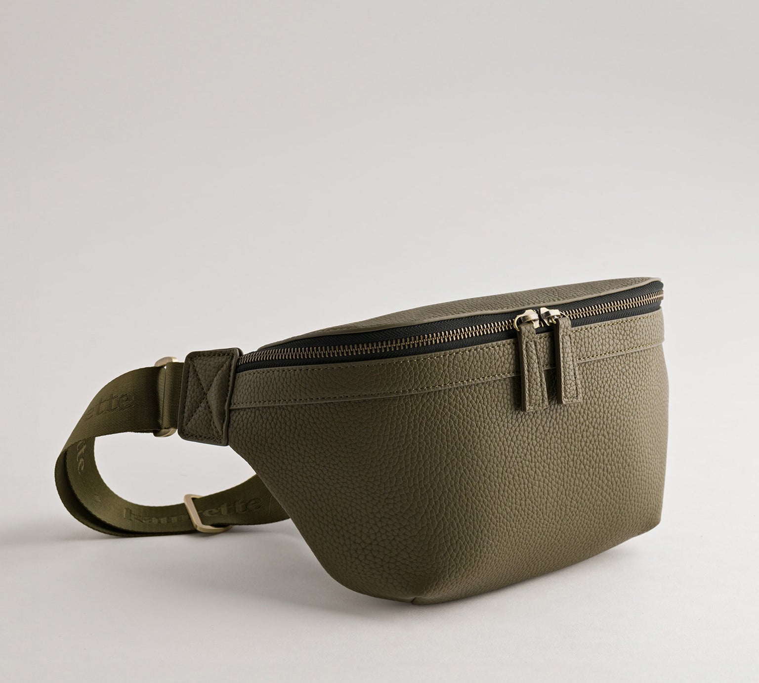 Versa Camera Crossbody - front view  of fanny pack in olive vegan leather