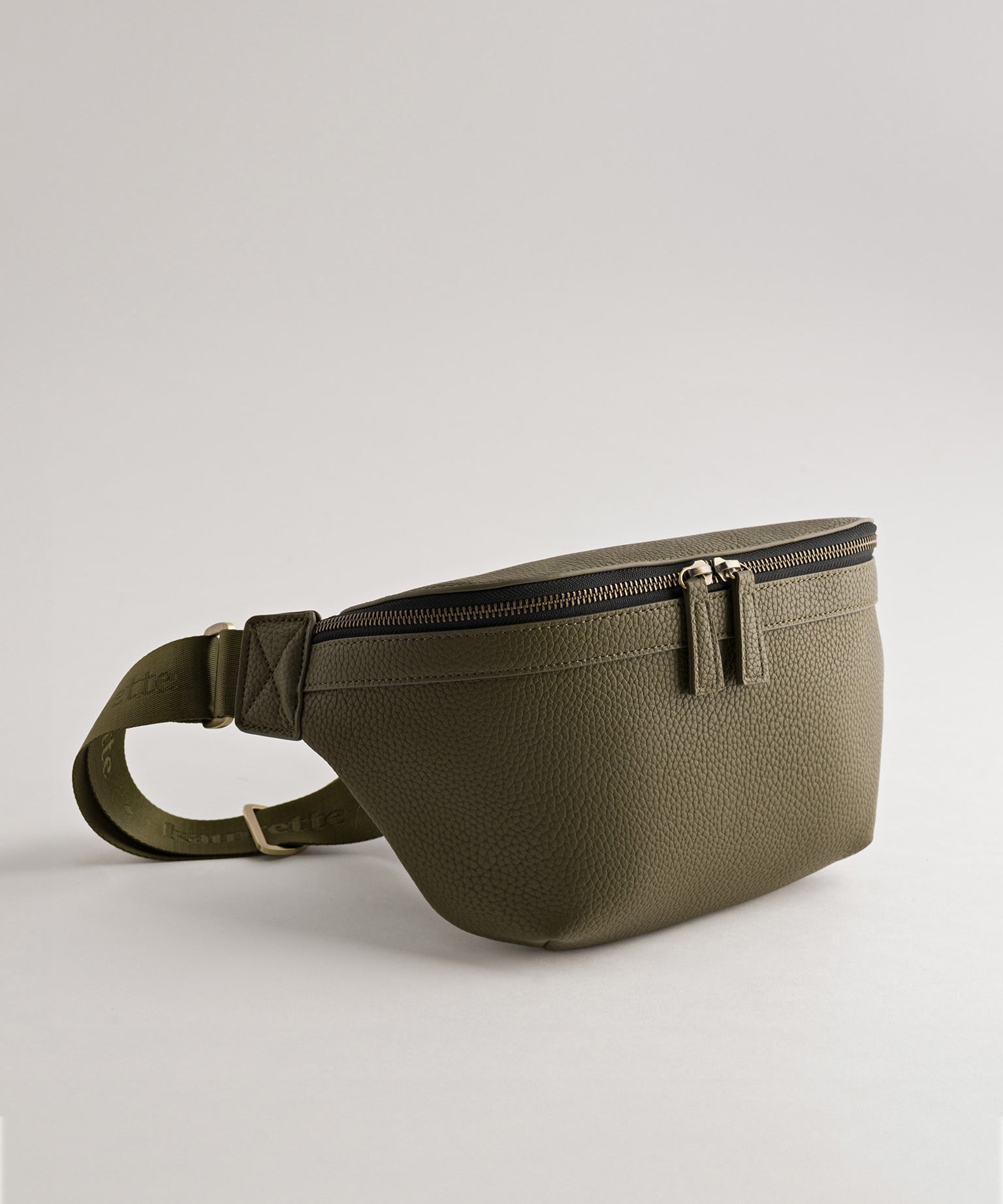 Versa Camera Crossbody - front view  of fanny pack in olive vegan leather
