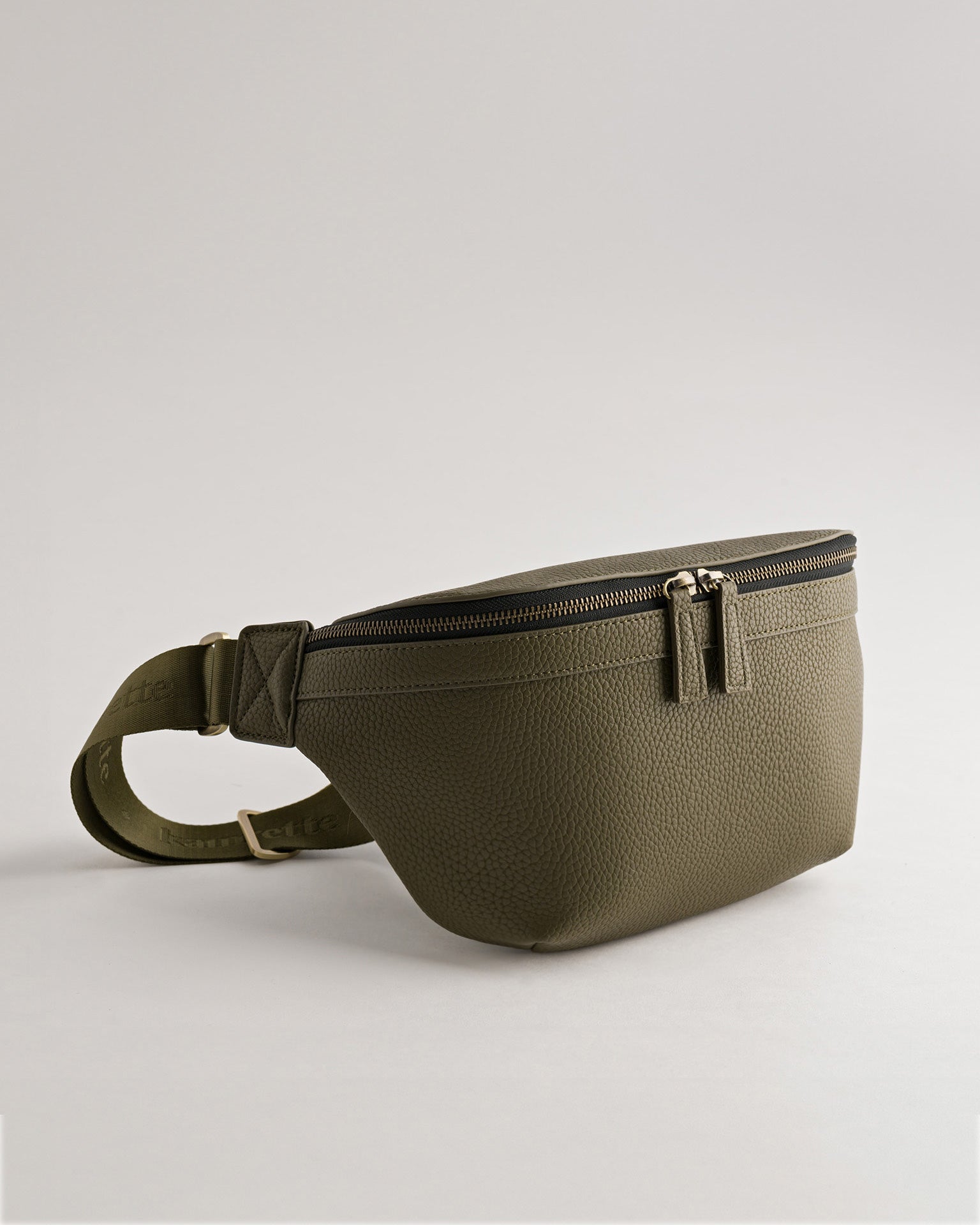 Versa Camera Crossbody - front view  of fanny pack in olive vegan leather