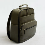 Lyra Camera Backpack - front view in olive vegan leather