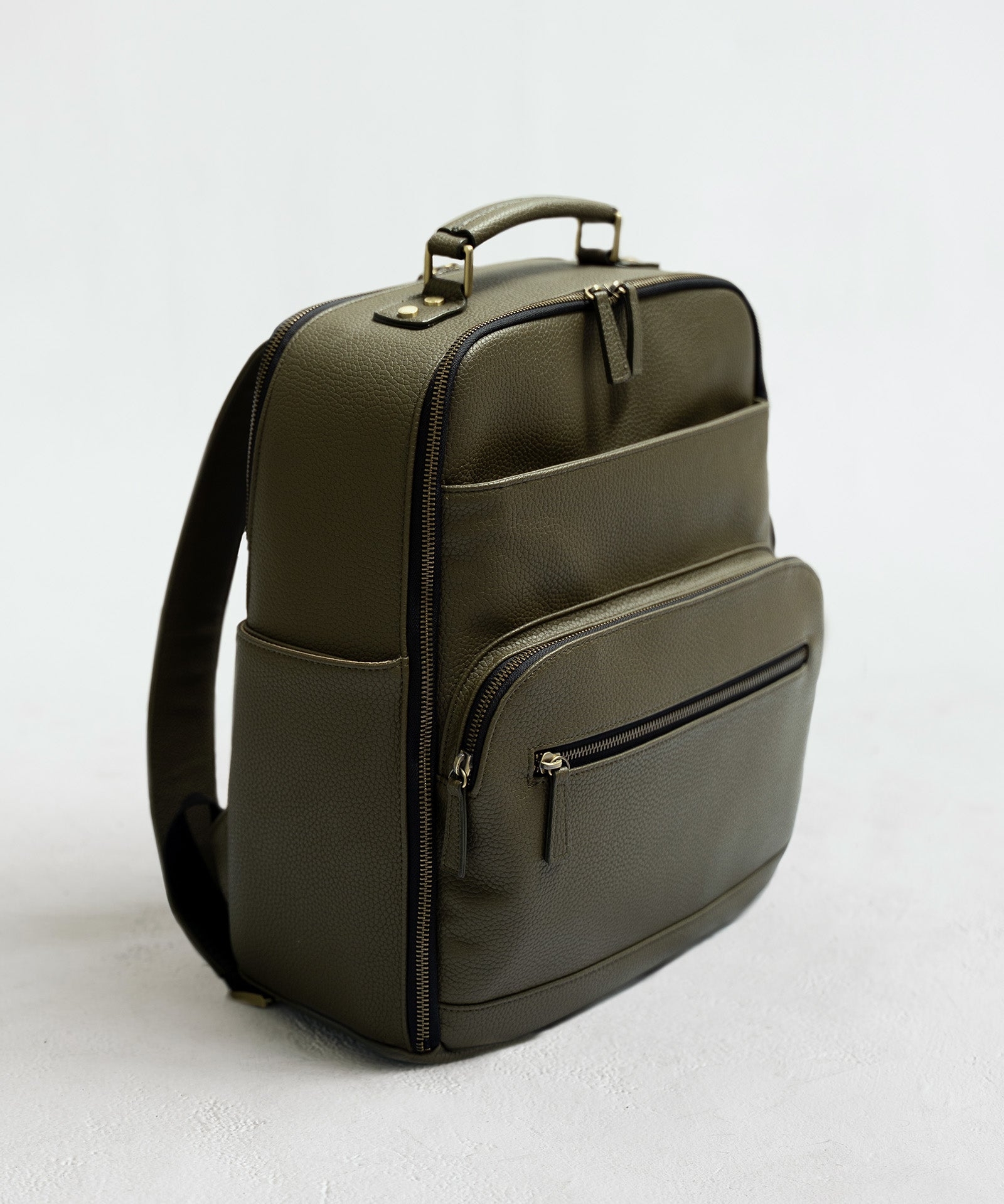 Lyra Camera Backpack - front view in olive vegan leather