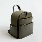 Mina camera backpack in olive vegan leather – front view