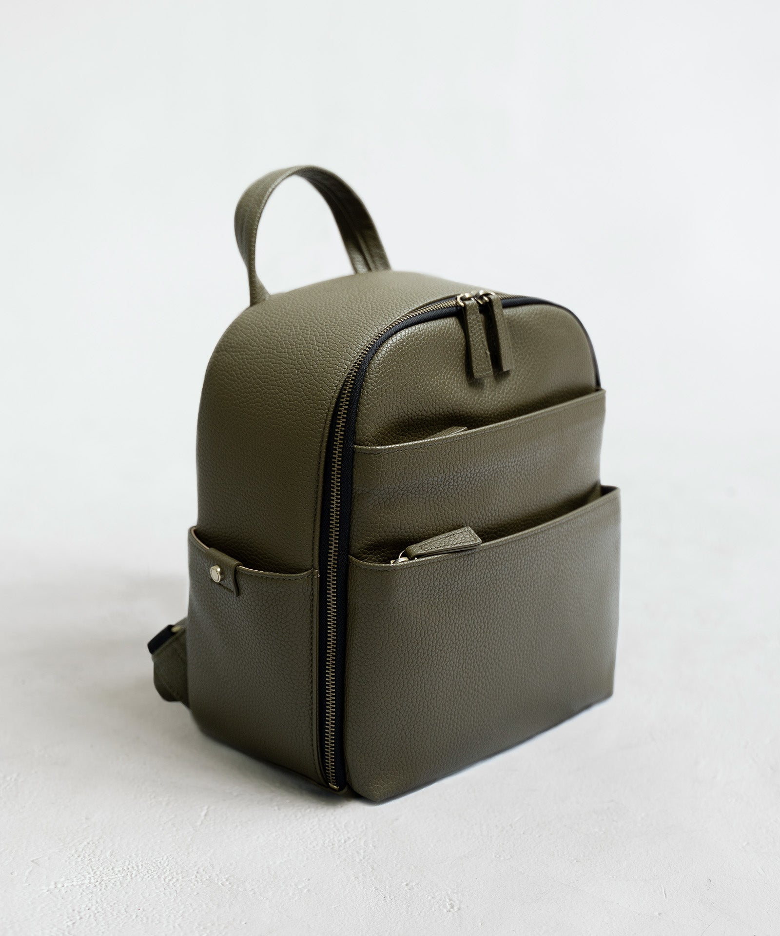 Mina camera backpack in olive vegan leather – front view