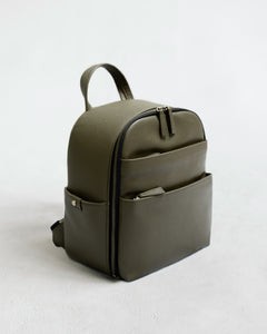 Mina camera backpack in olive vegan leather – front view