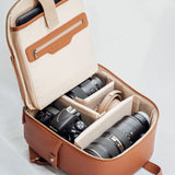 Mina backpack open with DSLR, mirrorless camera, lenses and accessories